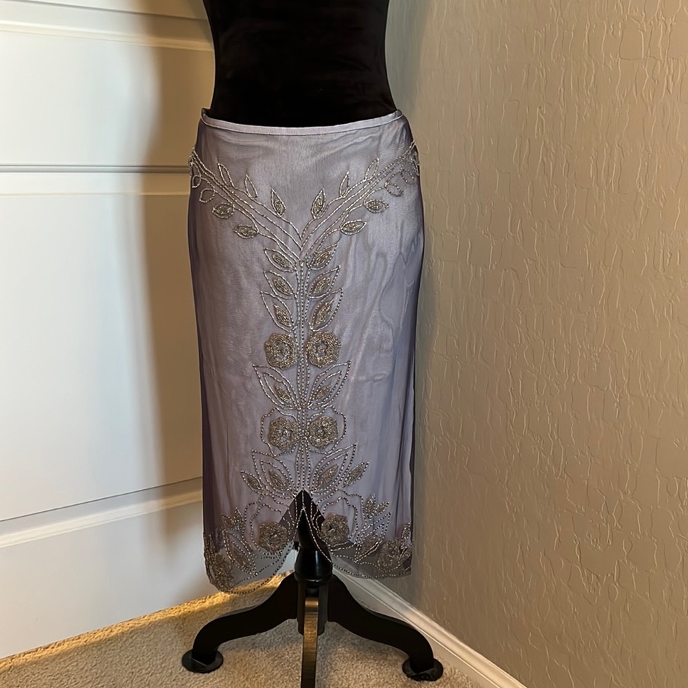 Hand-beaded fully lined skirt with scalloped front slit